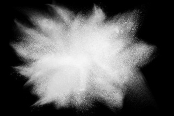 Freeze motion of white powder exploding black background  © pathdoc