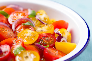red and yellow cherry tomatoes salad