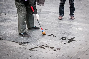 Foto op Canvas man practising chinese calligraphy, Temple of Heaven in Beijing © Fotokon