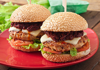 American burger with chicken and bacon, homemade barbecue sauce