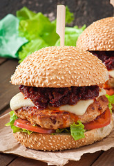 American burger with chicken and bacon, homemade barbecue sauce