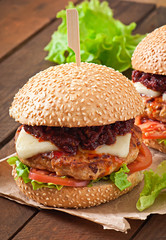 American burger with chicken and bacon, homemade barbecue sauce