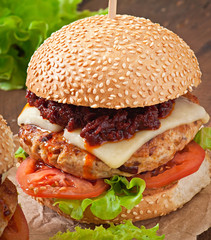 American burger with chicken and bacon, homemade barbecue sauce