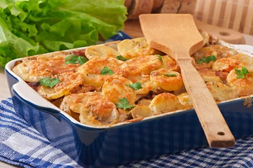 Fotobehang Potato casserole with meat and mushrooms with cheese crust © timolina