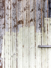 Part of  white painted wooden garage door