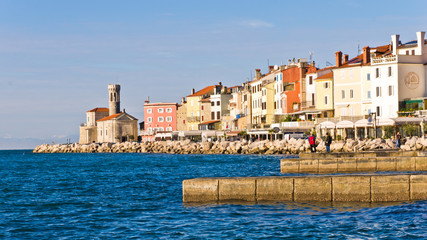 Fototapeta na wymiar Colorful architecture at harbor of Piran, coastal town in Istria