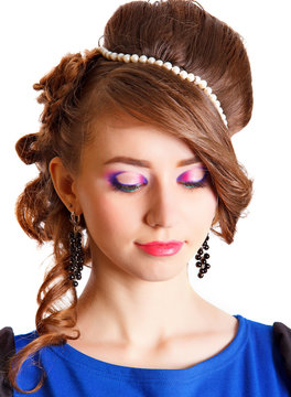 Portrait of a beautiful young woman with a bright makeup