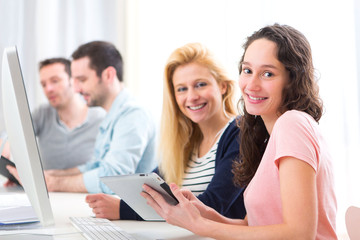 Fototapeta premium Young attractive people working together at the office