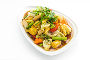 Fried vegetables Thai style on white plate