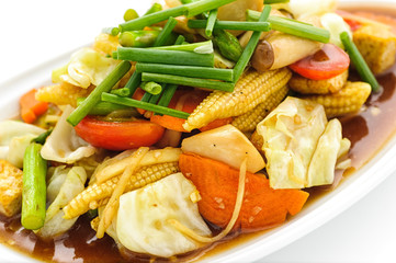 Fried vegetables Thai style on white plate