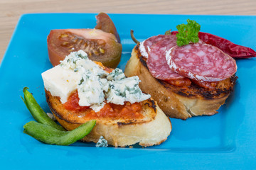 Tapas with cheese and salami