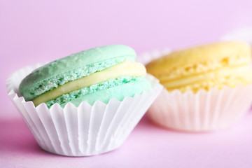 Gentle colorful macaroons on color background