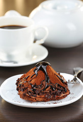 Yummy chocolate cupcake on table