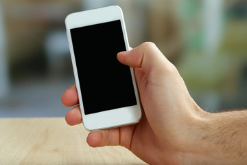 Hand holding smart mobile phone