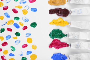 Colorful paint strokes on sheet of paper background