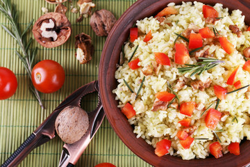 Rice with walnuts and cherry tomatoes in plate