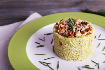 Rice with walnuts and rosemary in plate