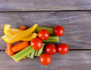 Fresh vegetables on rustic wooden planks background