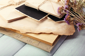 Vintage memories with dry flowers on wooden background