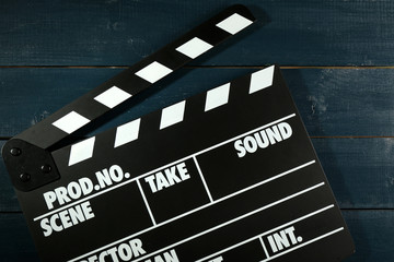 Movie clapper on wooden background