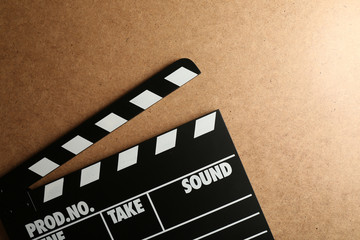 Movie clapper on wooden background
