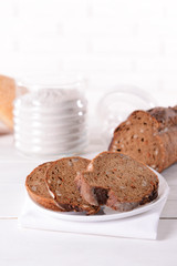 Tasty bread on table on light background
