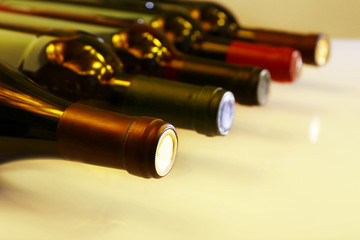 Wine bottles lying in row close-up