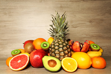 Assortment of exotic fruits on wooden background