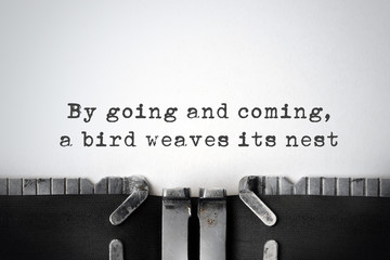 Practicality. Inspirational quote typed on an old typewriter.