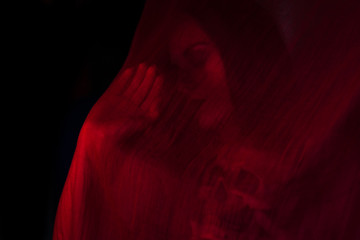 Girl posing with red fabric