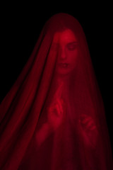 Girl posing with red fabric