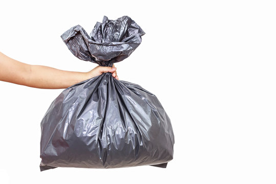 Hand Holding Garbage Bag