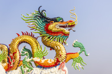 Golden chinese dragon and blue sky