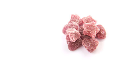 Purple colored sugar jelly candy over white background