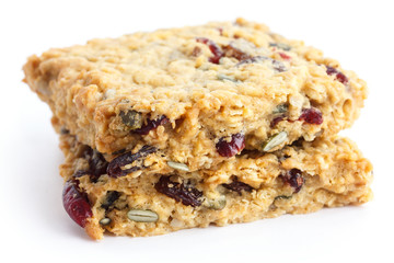 Homemade luxury fruit muesli bar. On white.
