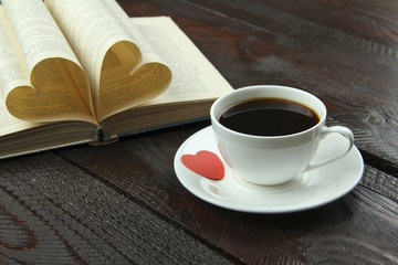Cup of coffee with book on valentines day