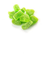 Green colored sugar jelly candy over white background