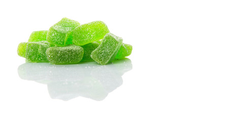 Green colored sugar jelly candy over white background