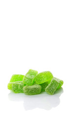 Green colored sugar jelly candy over white background