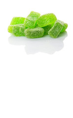 Green colored sugar jelly candy over white background