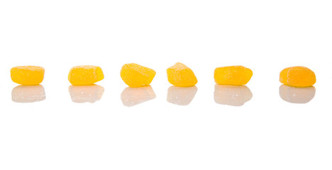 Yellow colored sugar jelly candy over white background