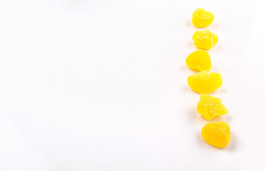 Yellow colored sugar jelly candy over white background