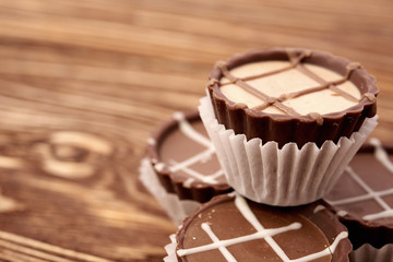 Dark chocolate on wooden background