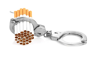 Addition concept with cigarettes and handcuffs