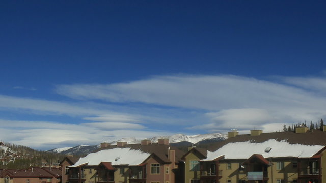 Time lapse clip of mountain ski town condos in winter