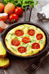 Omelet with vegetables and cheese. Frittata
