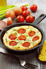 Omelet with vegetables and cheese. Frittata