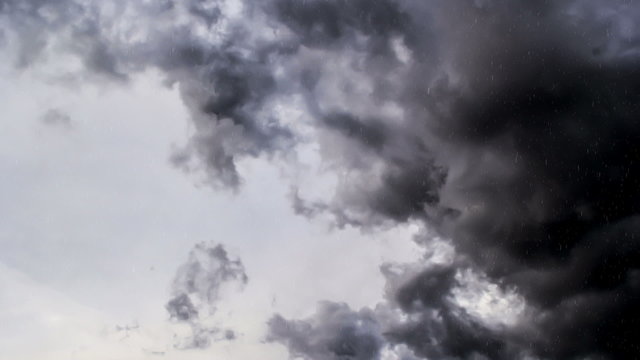 Time lapse of gray clouds as snow falls