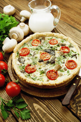 Kish with mushrooms and cherry tomatoes