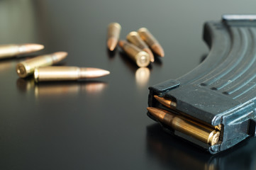 Kalashnikov bullets on the table.